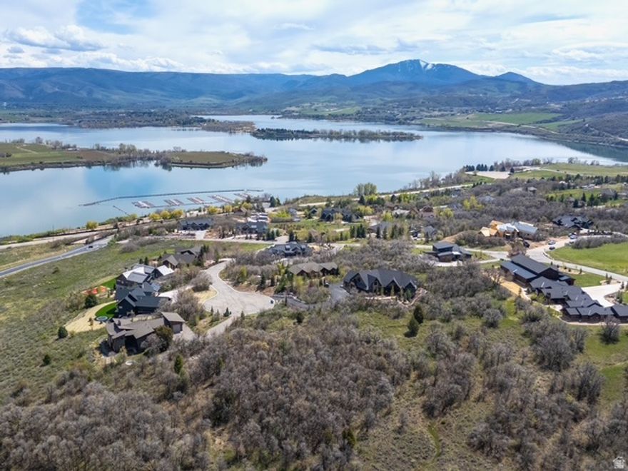 Amazing piece of land to build your dream home on with a beautiful view of Pineview Reservoir right out your front door, close by Nordic Valley , Powder Mountain, and Snow Basin ski resort, in the summer time you have access to all the Amazing hiking and biking trails, this lot is tucked backed in with the most privacy and the best mountain views from all around, you also have the Luxury of the gated community and all the perks with a private clubhouse for residents.