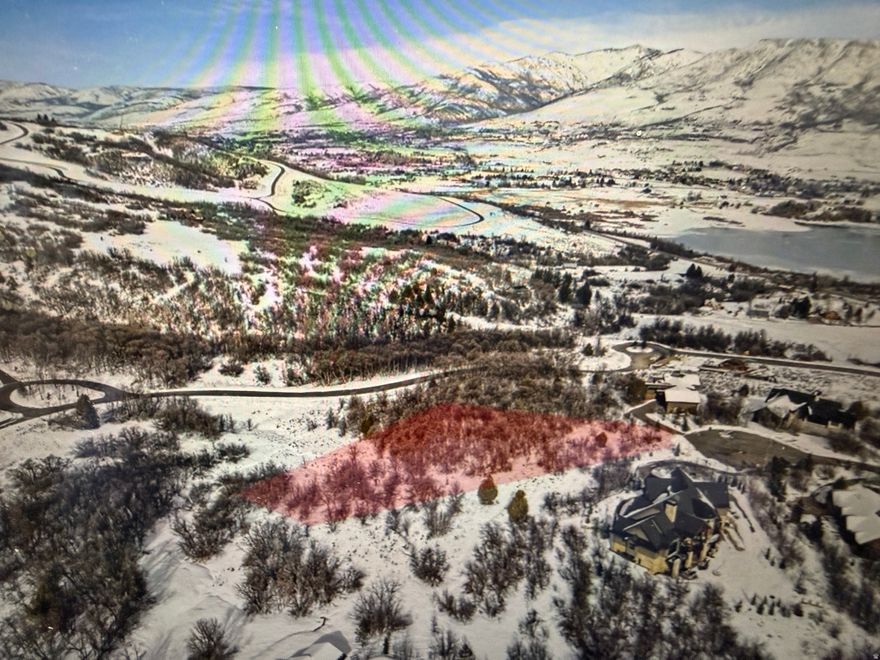 Amazing piece of land to build your dream home on with a beautiful view of Pineview Reservoir right out your front door, close by Nordic Valley , Powder Mountain, and Snow Basin ski resort, in the summer time you have access to all the Amazing hiking and biking trails, this lot is tucked backed in with the most privacy and the best mountain views from all around, you also have the Luxury of the gated community and all the perks with a private clubhouse for residents.