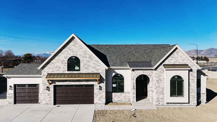 Regal 2-Story Home in American Fork We are excited to present the Roosevelt plan, boasting numerous standout features: -Open Flowing Floor Plan: Oh and we have Arches in this beauty -Elegant cabinetry through out including the Butler Pantry, fireplace with pre cast mantle and built ins on either side-Gourmet Kitchen: Equipped with a Cafe commercial range and a double built-in fridge/freezer combo. -Basement Entrance: Open staircase to basement. -Prime Location: Located in a well-established and beautiful neighborhood, close to all modern conveniences. This home is scheduled for completion end of January 2026. Don't miss out on the opportunity to make it yours. Call now for your personal showing! 20 K preferred lender incentive