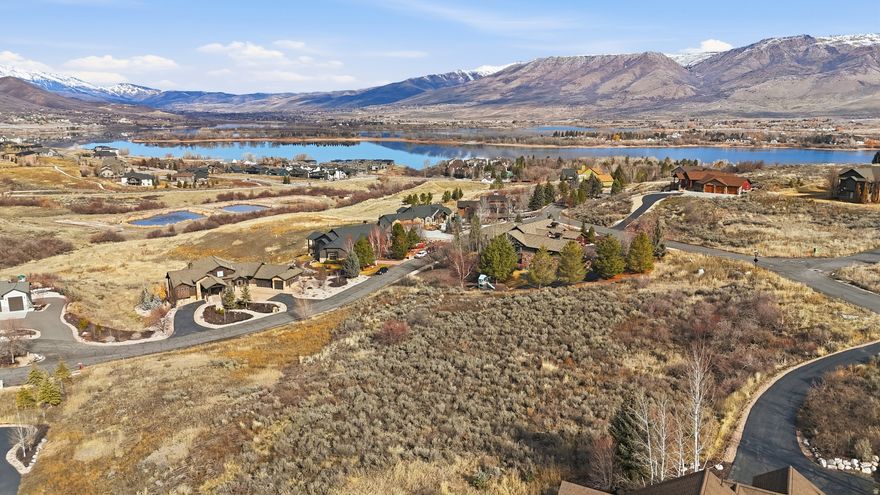 Experience elevated mountain living in the prestigious, gated Summit at Ski Lake community in Huntsville, Utah. This exceptional 1-acre homesite captures sweeping views of Pineview Reservoir and the surrounding valley - the perfect backdrop for your custom retreat. Offering a thoughtfully positioned homesite with generous, more functional build areas, this lot provides flexibility in design while preserving the panoramic vistas that make this location so sought after. Adventure begins at your doorstep with hiking and biking trails nearby, boating on Pineview Reservoir just minutes away, and championship golf at Wolf Creek. World-class skiing awaits only 10 minutes to Snowbasin and 30 minutes to Powder Mountain. Salt Lake City and Salt Lake International Airport are approximately 45 minutes away, offering effortless access while maintaining the privacy and serenity of mountain living. A rare opportunity to build in one of Northern Utah's premier resort-style communities.