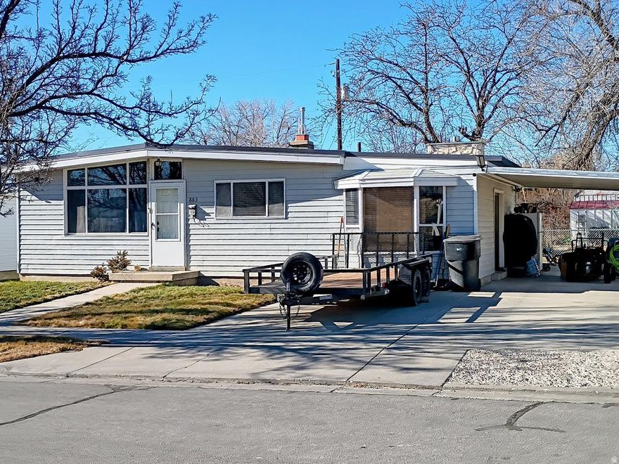 Price reduced by $5,000 on this charming, well maintained, move-in ready home! Adorable 4-bedroom home located in the desirable neighborhood of North Price. Check out the updated kitchen with a breakfast bar and a separate dining area with a bay window. The main level features a cozy gas fireplace with gas logs in the family room along with new carpet. There's a laundry area on the main level and a second laundry room in the basement. New carpet installed in the living room in December 2025. Vaulted ceilings in the living room and kitchen area offer plenty of natural light. Beautiful built-in hutch and cabinets located near the kitchen. 2018 updates include a metal roof, furnace, gas water heater and central air. Full bathroom in the basement and a 3/4 bathroom on the main level. Enjoy spending time on the patio with family and friends. Chain-link fence around the backyard installed in 2023. Includes a storage shed, a covered carport and 3 fruit trees in the backyard. Radon reduction system installed in the basement. There is alley access into the backyard. Don't wait to tour-this one may go fast!  No blind offers please! Square footage figures are provided as a courtesy estimate only and were obtained from the Carbon County Courthouse Tax Records. Buyer is advised to obtain an independent measurement.