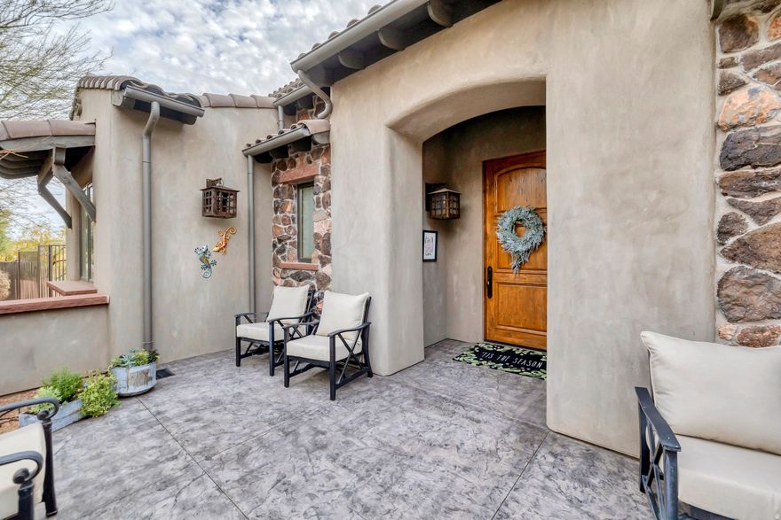 OPEN HOUSE SUNDAY JANUARY 4 FROM 10 TO 11:30 AM!  Located in the exclusive Whisper Ridge subdivision, this former Parade of Homes model offers incredible views and a layout designed for comfortable luxury. The great room features 20' vaulted ceilings, custom wood beams, and detailed ironwork that make a strong first impression. The upgraded kitchen includes Wolf/Sub-Zero appliances and custom lighting throughout. The large primary suite adds extra flexibility with an attached sunroom that works perfectly as a private office or studio. With no neighbors behind you, the backyard becomes a true extension of the home-complete with a Cowboy Kitchen, built-in BBQ, refrigerator, a massive outdoor rock gas fireplace, and Bullfrog hot tub.  It's a private setting built for everyday living and easy entertaining. Homes in Whisper Ridge rarely come available-this one is ready to be enjoyed.