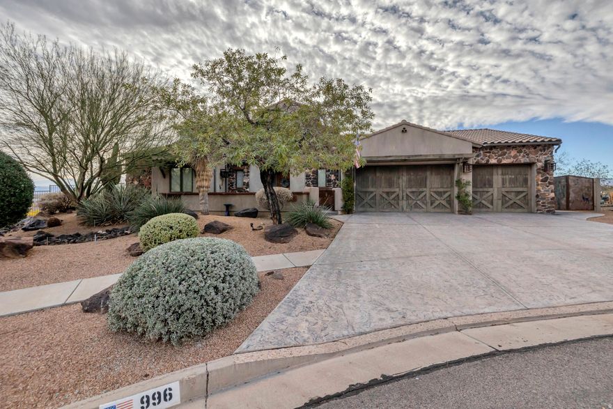 Price Improvement! Welcome to Whisper Ridge living at its finest. Nestled in this highly sought-after community, this former Parade of Homes model showcases breathtaking views and a thoughtfully designed layout that blends comfort with upscale finishes.    From the moment you enter, the great room makes a striking impression with soaring 20-foot vaulted ceilings, exposed custom wood beams, and intricate ironwork details. Built-in surround sound (indoors and out) and a central vacuum system add both convenience and modern functionality.    The chef's kitchen is beautifully appointed with premium Wolf and Sub-Zero appliances, complemented by custom lighting and quality craftsmanship throughout.    The spacious primary suite offers a peaceful retreat, complete with an attached sunroom-ideal for a private office, studio, or relaxation space. The ensuite bathroom features a stunning freestanding copper tub, creating a true spa-like experience.    Enjoy unmatched privacy with no rear neighbors, allowing the backyard to serve as a natural extension of the home. Designed for both entertaining and everyday enjoyment, outdoor features include a Cowboy Kitchen with built-in BBQ and refrigerator, an impressive rock gas fireplace, and a Bullfrog hot tub-all set in a serene, scenic setting.    Opportunities in Whisper Ridge are rare-this exceptional home is ready to be experienced.