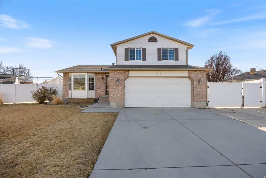 Tucked at the end of a quiet cul-de-sac, this beautifully remodeled Riverton home sits on a huge corner lot and checks every box. High-end finishes shine with travertine floors and newer carpet, complemented by extra storage in the basement and garage built-in shelving. Enjoy the oversized covered back patio, basketball court, RV parking, and additional storage shed. Washer, dryer, and fridge are included-all in the heart of Riverton with great neighbors. Clean, turn-key, and ready for its new owner.
