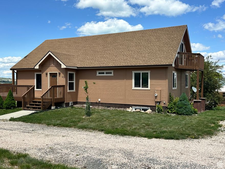 Motivated Seller!!! Are you looking for a family cabin in Bear Lake?  Look no further...  This charming cabin has 7 bedrooms with 4 of them with connecting bathrooms!  Large bedrooms, and a large loft for more sleeping or playroom.  Open kitchen/family room with walk in pantry.  Two other large gathering areas, with upper and lower decks to enjoy the beautiful sunrises and sunsets if Bear Lake.  This property is flat with lots of area to play on the grass and plenty of room to park cars or RV's.  Furnishings are negotiable.  Just a short drive down the hill to Bear Lake West Golf Course, Swimming Pool, tennis courts and Coopers Restaurant.  Make your appointment today for a private showing.  Square footage figures are provided as a courtesy estimate only and were obtained from County Assessor.  Buyer is advised to obtain an independent measurement.