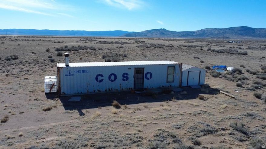Unique off-grid opportunity on 2.27 acres in Beryl, UT featuring a converted 40ft container home with 1 bed, 1 bath-perfect for a weekend getaway, Airbnb investment, or full-time remote living. Powered by solar w/ 2 panels and 4 batteries, plus an existing septic system. Easy year-round access and close to Highway 56, with Dixie Power approximately 1,300 feet away. Enjoy breathtaking mountain and valley views, wide open space, and incredible night skies. Ideal for a family retreat, recreational basecamp, or primary off-grid residence. Bring your campers, RVs, trailers, and toys. Located about 30 minutes from Enterprise for gas, groceries, dining, and medical services, 30 minutes to Newcastle Reservoir for boating and fishing, and only 1 hour 10 minutes to St. George and Cedar City.