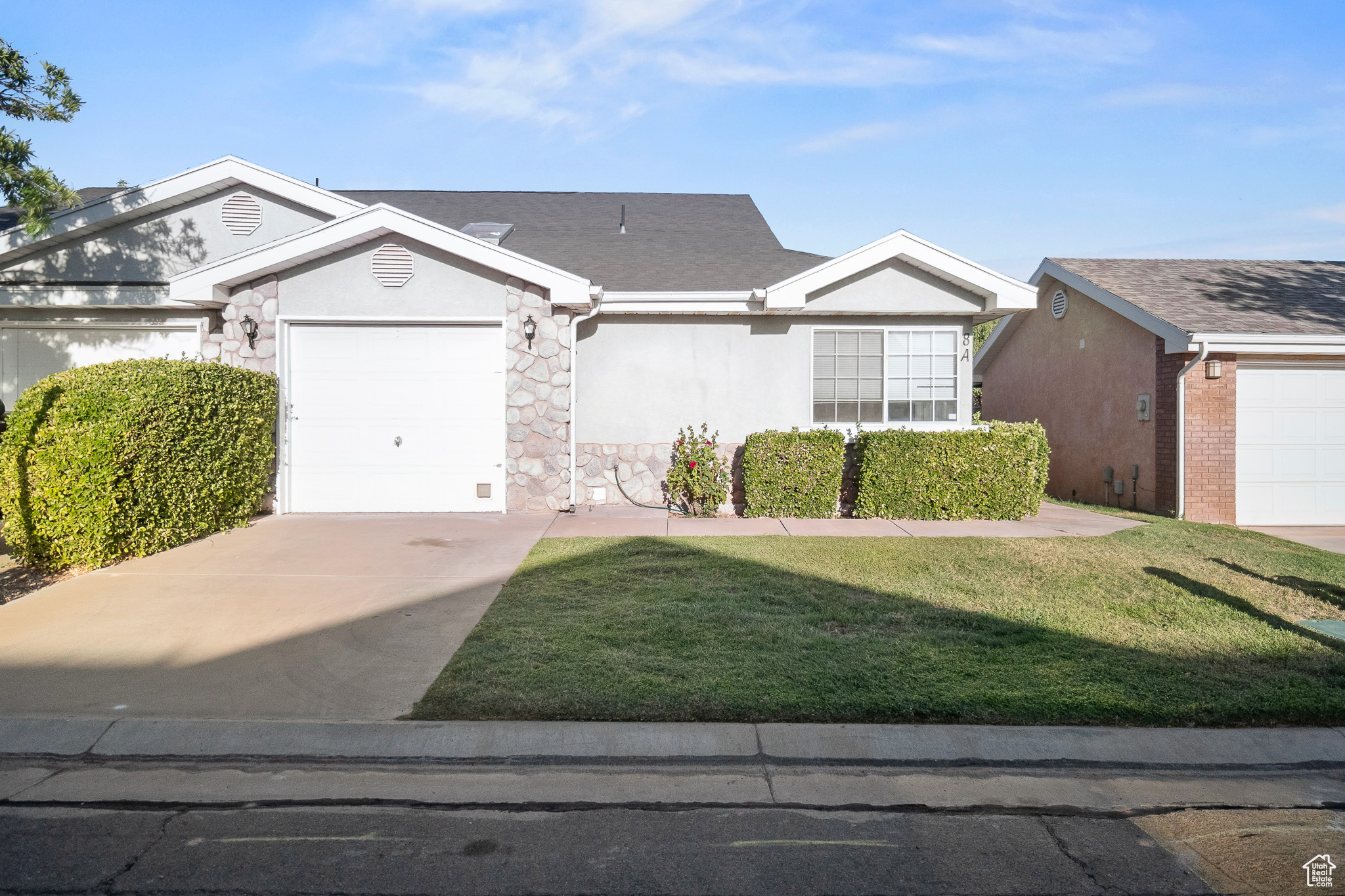 This nice and comfortable home features two bedrooms and two bathrooms, a spacious kitchen and huge great room, a bonus dining or office nook, an attached garage with water softener, and a cozy, private backyard. Conveniently located in the highly sought-after Green Valley area, near St. George's famous hiking and biking trails, top-rated restaurants, and all the outdoor recreation Southern Utah is known for. The quiet neighborhood offers a peaceful setting, but if you seek fun in the sun, a community pool is waiting just steps away. Perfect as an affordable full-time residence or a carefree vacation getaway.