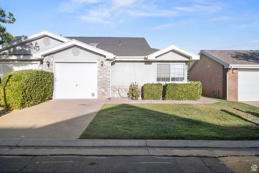 This nice and comfortable home features two bedrooms and two bathrooms, a spacious kitchen and huge great room, a bonus dining or office nook, an attached garage with water softener, and a cozy, private backyard. Conveniently located in the highly sought-after Green Valley area, near St. George's famous hiking and biking trails, top-rated restaurants, and all the outdoor recreation Southern Utah is known for. The quiet neighborhood offers a peaceful setting, but if you seek fun in the sun, a community pool is waiting just steps away. Perfect as an affordable full-time residence or a carefree vacation getaway.