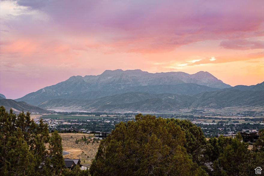 Welcome to Red Ledges, an exclusive private community where luxury mountain living meets world-class golfing. Set against the breathtaking backdrop of Utah's scenic Heber Valley, this custom homesite presents a rare opportunity to design and build your ideal retreat in one of the region's most prestigious settings.  Situated on over two-thirds of an acre, the property features a gentle downhill slope, ideal for creating a spacious, thoughtfully designed residence that takes full advantage of the surrounding views. With a full Golf Membership to the Red Ledges Club available (separate deposit required), you'll enjoy access to year-round amenities, including the Jack Nicklaus Signature Golf Course and Golf Park, state-of-the-art fitness and wellness facilities, pools, tennis, pickleball, and an unmatched lifestyle at the heart of the community.  This homesite offers the perfect combination of location, privacy, and lifestyle - a place to build your vision and experience the very best of Red Ledges living.