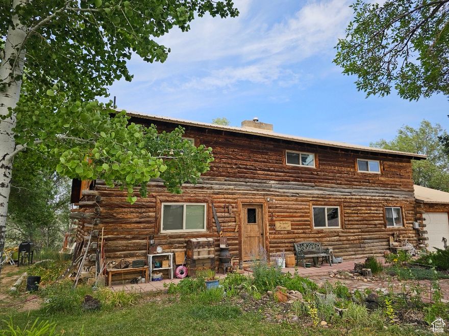 Charming 2145 SF Log Home on 60.01 Acres, Water and Wheel Lines  A Rare Find! Discover your dream retreat with this unique log home with an attached 2-car garage. It is perfectly nestled at the end of a serene street. Offering unparalleled privacy, this property boasts 60.01 expansive acres, complete with two wheel lines, water shares, two springs, a perennial steam, and a spacious 30 x 40 shop/hanger with electric doors. The attached 2-car garage provides convenience, while the vast open space offers endless possibilities for your hobbies, whether it's farming, gardening, raising animals, or storing all your toys. This property is an ideal sanctuary for those seeking a blend of rustic charm and ample room to grow. The home is being sold "as is," and the sellers kindly request a 24-hour notice for all showings. Don't miss out on this rare opportunity  schedule your visit today! Buyers to verify all. Agents please see remarks for excluded items.