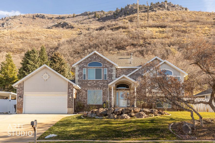 Location, Views, Privacy! Your paradise awaits at 2522 N 1600 E in North Ogden!   Live above it all with the mountain as your backyard neighbor, views from every window, and a location that inspires envy from those who didn't find it first. And a rare opportunity to assume a 3.75% interest rate (contact listing agent for details).   This 5 bedroom, 3.5 bath home boasts just over 3,100 square feet and feels even larger thanks to its semi-open layout. From the moment you walk in the front door, you'll feel welcomed by the soaring 2-story entry way and formal living room, both of which are enhanced with plentiful natural light thanks to luxuriously large windows.   As you transition to the main living area of the home, you'll find a kitchen/dining area that is adjoined to the family room. The kitchen is perfect for entertaining thanks to features like peninsula seating, a double oven, and even real oak cabinetry with granite countertops! The dining room, which is open to both the kitchen and the family room helps bring balance to the concept of open living without sacrificing the need for separately functional spaces.   Just off the family room, you'll find one bedroom which could also serve as an in-home office. A separate 3/4 bathroom also presents the potential for this to act as a private guest suite! As you head downstairs, you'll find a fully finished basement with plenty of space for fun, games, and storage. The basement layout is currently open, but with the addition of a wall, there's enough space to add a bedroom without compromising the spacious feel.   The rest of the bedrooms are all found upstairs with 3 bedrooms and one bathroom being in one "wing" of the home. Each of these bedrooms have great views and plenty of space. The Master suite, completely separated from the other bedrooms and on the north wing of the house, boasts a large bedroom with vaulted ceilings and the best views in the whole house! A full walk-in closet, separate tub and shower, and double vanity setup mean you really can make this space your private sanctuary.   Lest you think that's all, now is a good time to remind you that the garage is a 3-car tandem! And thanks to a massive shed out back, you'll be able to use the entirety of your garage for parking. Perhaps more importantly, all of the expensive updates have already been done - Brand new windows, a brand new heating and cooling system, and a brand new hot water heater will protect your investment for years to come.