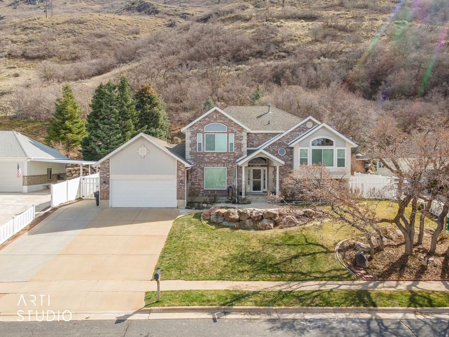 Location, Views, Privacy! Your paradise awaits at 2522 N 1600 E in North Ogden!   Live above it all with the mountain as your backyard neighbor, views from every window, and a location that inspires envy from those who didn't find it first. And a rare opportunity to assume a 3.75% interest rate (contact listing agent for details).   This 5 bedroom, 3.5 bath home boasts just over 3,100 square feet and feels even larger thanks to its semi-open layout. From the moment you walk in the front door, you'll feel welcomed by the soaring 2-story entry way and formal living room, both of which are enhanced with plentiful natural light thanks to luxuriously large windows.   As you transition to the main living area of the home, you'll find a kitchen/dining area that is adjoined to the family room. The kitchen is perfect for entertaining thanks to features like peninsula seating, a double oven, and even real oak cabinetry with granite countertops! The dining room, which is open to both the kitchen and the family room helps bring balance to the concept of open living without sacrificing the need for separately functional spaces.   Just off the family room, you'll find one bedroom which could also serve as an in-home office. A separate 3/4 bathroom also presents the potential for this to act as a private guest suite! As you head downstairs, you'll find a fully finished basement with plenty of space for fun, games, and storage. The basement layout is currently open, but with the addition of a wall, there's enough space to add a bedroom without compromising the spacious feel.   The rest of the bedrooms are all found upstairs with 3 bedrooms and one bathroom being in one "wing" of the home. Each of these bedrooms have great views and plenty of space. The Master suite, completely separated from the other bedrooms and on the north wing of the house, boasts a large bedroom with vaulted ceilings and the best views in the whole house! A full walk-in closet, separate tub and shower, and double vanity setup mean you really can make this space your private sanctuary.   Lest you think that's all, now is a good time to remind you that the garage is a 3-car tandem! And thanks to a massive shed out back, you'll be able to use the entirety of your garage for parking. Perhaps more importantly, all of the expensive updates have already been done - Brand new windows, a brand new heating and cooling system, and a brand new hot water heater will protect your investment for years to come.