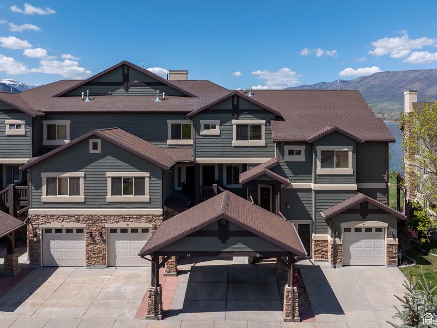 Enjoy lakeside living in this beautifully maintained 2-bedroom, 2-bathroom condo perfectly positioned on the shores of Pineview Reservoir. Offering a seamless blend of comfort and convenience, this residence is being sold fully furnished, making it a true turnkey opportunity for full-time living, a vacation getaway, or investment potential.  Step inside to find a warm and inviting open-concept floor plan featuring a spacious kitchen with stainless steel appliances, knotty alder cabinetry, and slate tile flooring. The adjoining living area with a cozy stone fireplace, and direct access to a private deck where you can relax and take in the lake and mountain views.  The primary suite provides a peaceful retreat with an en-suite bathroom, while the second bedroom and additional full bath offer flexibility for guests or family.   Outside, enjoy the covered parking and community amenities, along with unmatched access to year-round adventure. Spend summer days boating and paddleboarding on Pineview Reservoir, or head just minutes away to Snowbasin Resort, world-renowned for skiing, snowboarding, and its Olympic legacy. Hiking, biking, and other mountain activities make this condo the ideal four-season retreat. All property information, boundaries and documents to be verified by buyer.