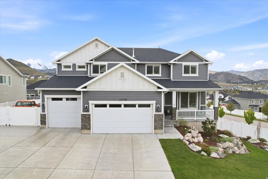 Stunning 2-story home with breathtaking views, especially the unforgettable sunsets, nestled in a quiet and beautiful neighborhood! This exceptional home features a gourmet kitchen with granite countertops throughout, double ovens, and a gas cooktop-perfect for both everyday living and entertaining. The spacious primary suite includes a luxurious bathroom with double vanities and an oversized walk-in closet. Enjoy outdoor living on the covered deck and patio, with walkout access to the basement featuring 9-foot ceilings. Additional highlights include a large covered porch with cold storage, laminate wood flooring, an extra-deep 3-car garage with room for up to 4 vehicles, a dedicated area for a garden with growboxes, and an area perfect for some fruit trees. Upstairs, you'll find a large family room offering plenty of space to relax or gather privately. Located in a gorgeous community with NO HOA fees, this home truly shows beautifully!  Easy access to all the great canyon trails in Herriman.