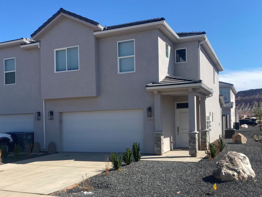 End unit in Crimson Cliffs HS boundary. Main floor has LVP flooring throughout. All 3 bedrooms are upstairs along with a 2nd family room area and laundry. Master has large WIC. Backyard enclosed with block wall and a gate. Nice HOA Park right across the street. Dixie power. Owner/ Agent