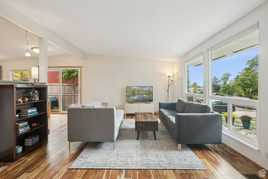 Nestled above Wasatch Boulevard in one of Millcreek's most desirable pockets and with a price improvement to match! This thoughtfully updated home sits perfectly tucked into the base of Mount Olympus. Iconic views? Check. Versatile layout? Absolutely. Outdoor space that's nothing short of magical? You've got that too. A lockout ADU option adds rental potential or flexible guest accommodations-perfect for those looking to house-hack, create a separate workspace, or host long-term visitors. The rustic butler's pantry evokes cozy cabin vibes, while the bright kitchen and living areas flow seamlessly into expansive patio spaces. Whether you're gathering with friends, dining al fresco, or simply soaking in the serenity of your private yard, this outdoor space delivers. Gardeners will love the established fruit trees, vegetable beds, and room to grow even more. Morning coffee with a mountain view? Evening entertaining under the stars? This property combines location, charm, and utility in a way that's rare to find.