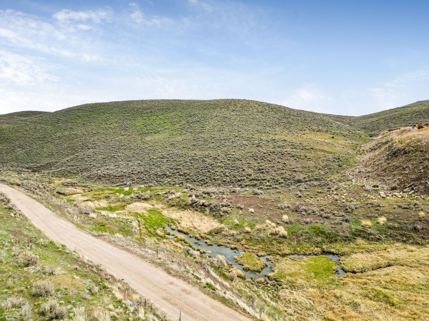 Located just minutes from Deer Valley Resort and historic Main Street Park City, this exceptional 40.55-acre parcel offers a rare combination of privacy, convenience, and breathtaking scenery. Tucked off High View Road and Brown's Canyon Road, the property features a seasonal stream running through the lower portion of the land, while the upper areas capture sweeping views of Deer Valley and Park City Mountain Resort. The location provides easy access to both Jordanelle Reservoir and Rockport Reservoir, making it ideal for year-round recreation. An easement is already in place for a future home site and driveway access from High View Road, with additional access points available throughout the property. With no HOA, flexible building opportunities across the entire parcel, and no required timeline to begin construction, this property offers the freedom to create a custom mountain retreat on your own schedule. Large acreage parcels this close to Park City, skiing, reservoirs, and recreation are increasingly difficult to find, making this an outstanding opportunity to own a significant piece of land in one of Utah's most sought-after areas.