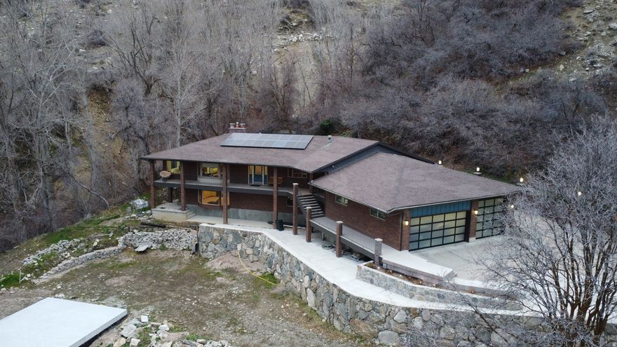 GRAND OPENING OPEN HOUSE: MARCH 7, 2026: 11AM - 3PM. OPPORTUNITY OF A LIFETIME! Appraised as-is at $1.2m, this 5bd/4ba, 5,000+ sq ft custom home sits at the end of a cul de sac on 3.5 acres with Steed Creek rolling through the property. Nestled in the hills with incredible sunset views, this home combines the convenience of the suburbs with the privacy and beauty of nature. Oversized 3 car attached garage with RV and coated floor and 2 car subterranean toy garage, along with extra RV parking on the side of the home. Back yard has play structure, hot tub, and enormous dog run with the sound of the creek and annual plants for natural beauty. Main floor boasts huge custom office with two desks, very large master suite with WIC, large custom stainless kitchen, and storage galore! The walkout basement includes views, a HUGE pool/rec room, and theater space with keva seating. Solar panels, whole-home natural gas generator (with propane backup) ensure no power outages and low utilities! Front yard is a blank slate ready for your dreams with most expensive retaining complete! Excellent schools, neighbors, proximity to freeway access, parks, shopping at Station Park and nightly sunset views make this location unbeatable. Hurry, before this opportunity is gone! Buyer to verify all info. Other parcel number included with sale is:  07-036-0017.