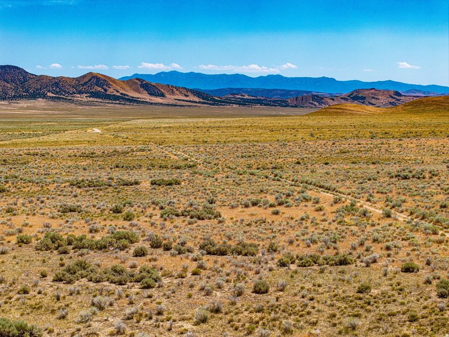Located approximately 24 miles west of Nephi and surrounded by large tracts of nearby BLM-managed land, this land offers long-term privacy, open views, and limited development pressure. The property has legal access, no HOA, and broad use flexibility under county vacant land zoning. Sitting at an elevation of roughly 5,380 feet, the mostly flat terrain makes the land suitable for a range of residential, recreational, or off-grid uses. The parcel is off-grid with no existing power or water infrastructure, and buyers should plan for alternative power sources, water hauling or well installation (buyer to verify), and septic if development is planned. Access is provided by paved highway followed by maintained dirt and gravel roads, with the final stretch best suited for high-clearance or 44 vehicles. With no HOA restrictions, the property allows for residential construction, mobile or manufactured homes, tiny homes, barndominiums, RV use, camping, and recreational activities.  **Address is an approximation - location is approximate.