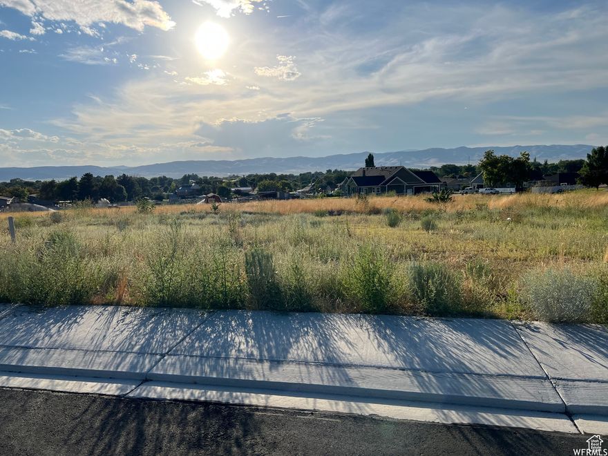 This .41 acre lot in the new Jamestowne subdivision is just waiting for your home building plans. Gorgeous mountain views to the north and east are complimented by a spacious vista across the valley to the west. The slightly sloping lot allows for a walkout basement, if you desire. The irrigation easement on the west side of the property is underground. Curb, gutters and street are complete, and utilities are stubbed to the lot.