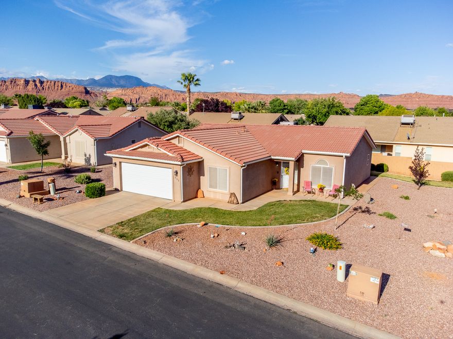 Well-maintained home in the sought-after Padre Lakes community in Ivins! This 1,477 sq ft, 3 bed, 2 bath home offers an open layout with vaulted ceilings and great natural light. The kitchen features upgraded countertops, ample cabinetry, and a large breakfast bar-perfect for everyday living and entertaining. The spacious primary suite provides a comfortable retreat, while plantation shutters throughout add charm and efficiency. Enjoy low-maintenance desert landscaping, a welcoming back patio.  Clean, move-in ready, and easy to love.