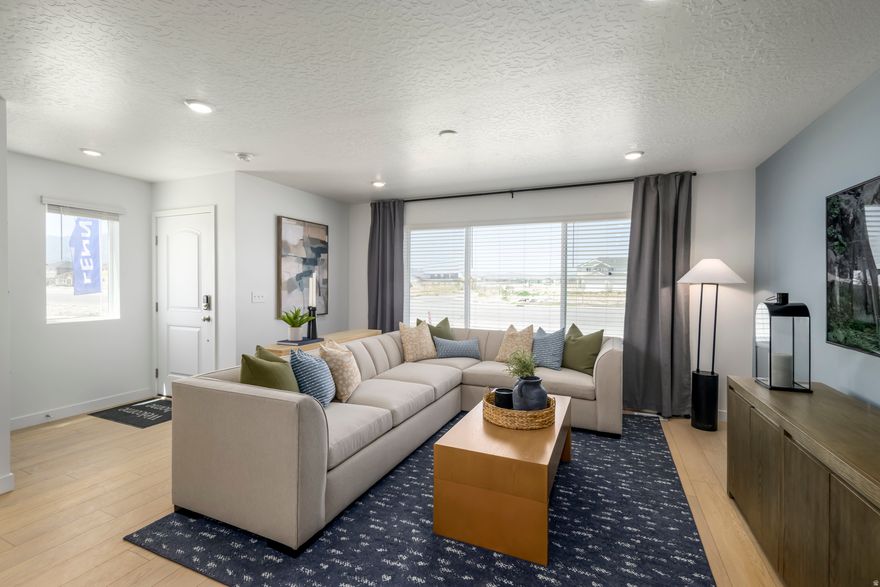 Former model home in the heart of Eagle Mountain! This turnkey townhome has been meticulously maintained and is loaded with upgrades-designer finishes, custom accent walls, and premium fixtures throughout. one. Close to parks, schools, and new amenities-this one's a must-see!