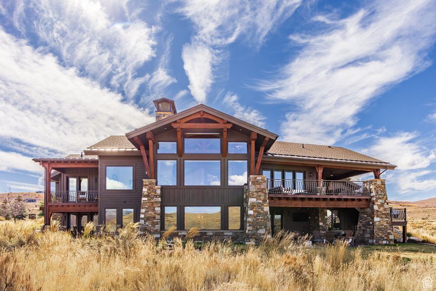 Experience elevated mountain living in this exquisite custom home nestled within the exclusive community of Victory Ranch. Thoughtfully designed to capture breathtaking views of the Provo River Deer Valley and Rock Cliffs, this 5-bedroom, 8-bathroom home offers an unparalleled blend of luxury, comfort, and privacy. Each of the five spacious bedrooms features its own ensuite bath, providing ultimate privacy for family and guests. The refined interior includes natural finishes, expansive living spaces, and seamless indoor-outdoor flow to take in the surrounding landscape. Located in one of Utah's most prestigious gated communities, residents enjoy access to world-class amenities including championship golf, fly fishing, backcountry trails, and more all just minutes from the new Deer Valley East Village.