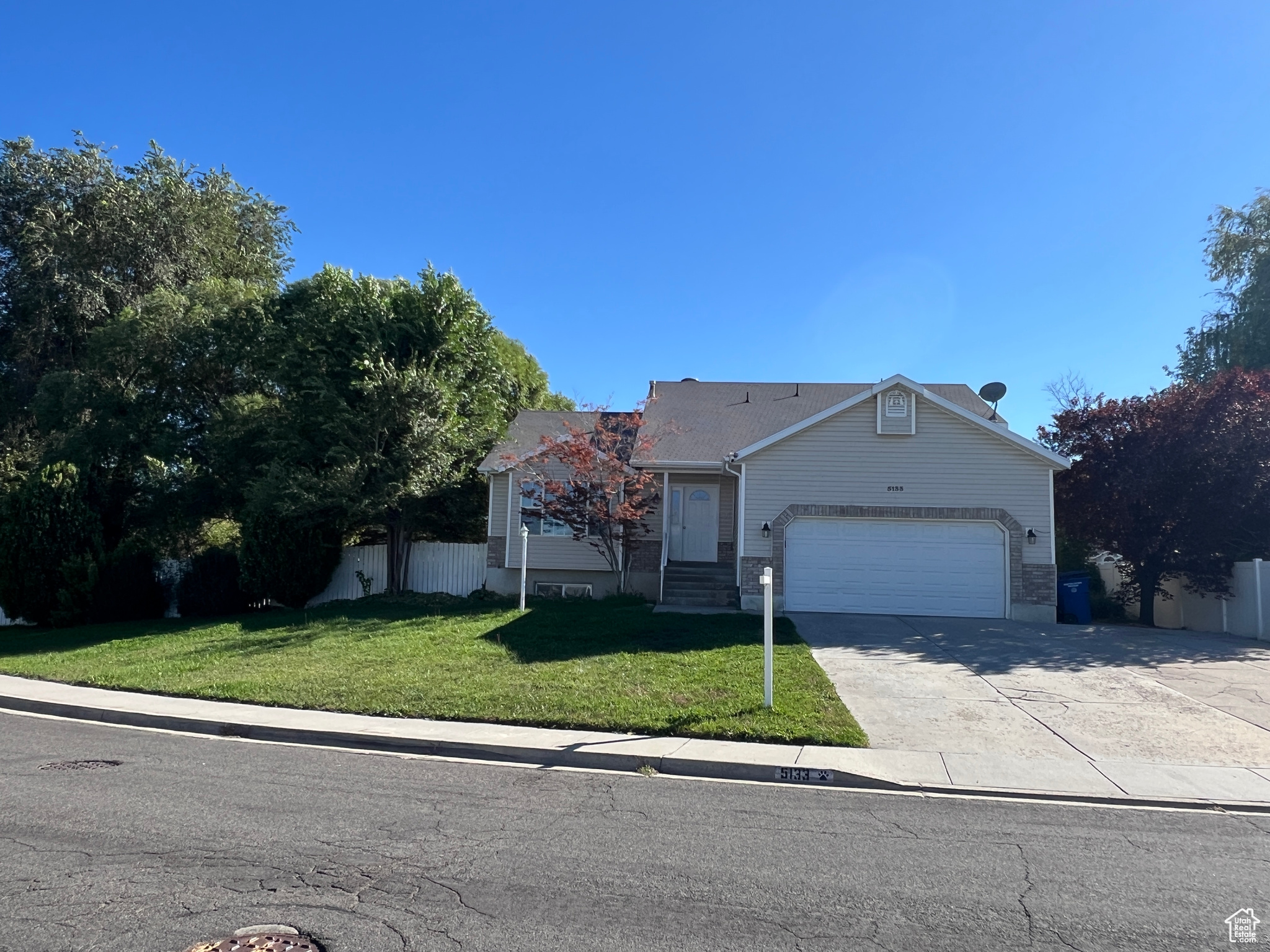 Welcome to this beautiful West Valley City home tucked into a charming neighborhood! Sitting on a spacious quarter acre corner lot, the property is surrounded by mature trees that create a shaded, private backyard-perfect for relaxing or entertaining. Inside, you'll love the open layout with 4 bedrooms and 3 bathrooms, including a large master suite with walk-in closet, jetted tub, and separate shower. The oversized laundry room with its own entrance was even set up as a hair salon. With a little updating, this home can truly shine-and it's priced right to make it your own! - Square footage per previous listing. Information deemed reliable but not guaranteed. Buyer to verify all information.