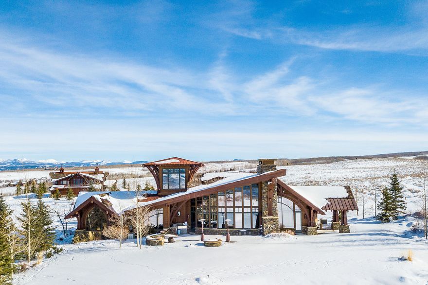 Situated in the heart of Wolf Creek Ranch, this extraordinary 6,100 sqft mountain retreat is more than just a home-it's an escape into nature's grandeur. While the property spans an impressive 160 acres, the home is thoughtfully situated on approximately 10 manageable acres, offering a balance of easy upkeep and the unparalleled privacy of an additional 150 acres of surrounding land.  Designed to elevate every moment, this rare gem seamlessly blends rustic charm with refined luxury. Soaring windows flood the space with natural light, while vaulted ceilings with exposed timber beams create a breathtaking welcome. With 3 bedrooms, 4.5 bathrooms, and a beautifully crafted barn that accommodates up to four horses or all the motorized toys you desire, this property offers the perfect balance of elegance and functionality. Whether you seek solitude, adventure, or the ideal space to gather with loved ones, this home delivers in every way.     Wolf Creek Ranch offers an unmatched lifestyle-a private, gated sanctuary with 60 miles of scenic trails for hiking, horseback riding, and winter adventures. Cast a line in private trout ponds, relax along the pristine Provo River, or unwind at the Ranch Center, complete with a community kitchen, fire pit, and owner's loft. Horse enthusiasts will appreciate the community's well-maintained equestrian facilities, offering a relaxed program with plenty of space to ride and explore the vast landscape. With a fuel center for ATVs and snowmobiles, every season brings new possibilities. Don't just dream about mountain living-experience it. Come see for yourself why Wolf Creek Ranch is where adventure meets serenity.