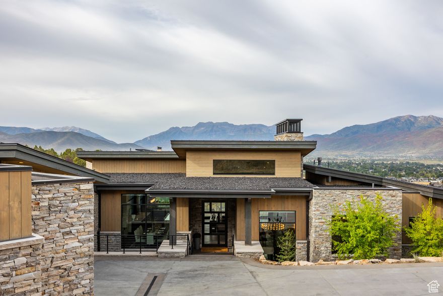 Discover the perfect blend of luxury, comfort, and privacy in this 5,851 sq. ft. mountain estate, thoughtfully designed and crafted by JD Construction. Situated on .83 acres in the prestigious Red Ledges community, this home offers seclusion among mature juniper trees while showcasing panoramic views of the Wasatch Mountains. Step inside to soaring ceilings and a striking marble-slab fireplace in the great room, where natural light frames the sweeping vistas. The gourmet kitchen is a chef's dream, featuring an oversized island, Thermador appliances, two dishwashers, and a dedicated ice maker-perfect for entertaining on any scale. With 5 spacious bedrooms, 5 full bathrooms, and 2 powder rooms, the home provides both privacy and convenience for family and guests. The oversized 3-car garage and heated driveway make mountain living effortless year-round. Unwind on expansive patios, take in the mountain air, and enjoy the unmatched amenities of Red Ledges, including golf, dining, swimming, and club facilities. A full Golf Membership is available with this property.