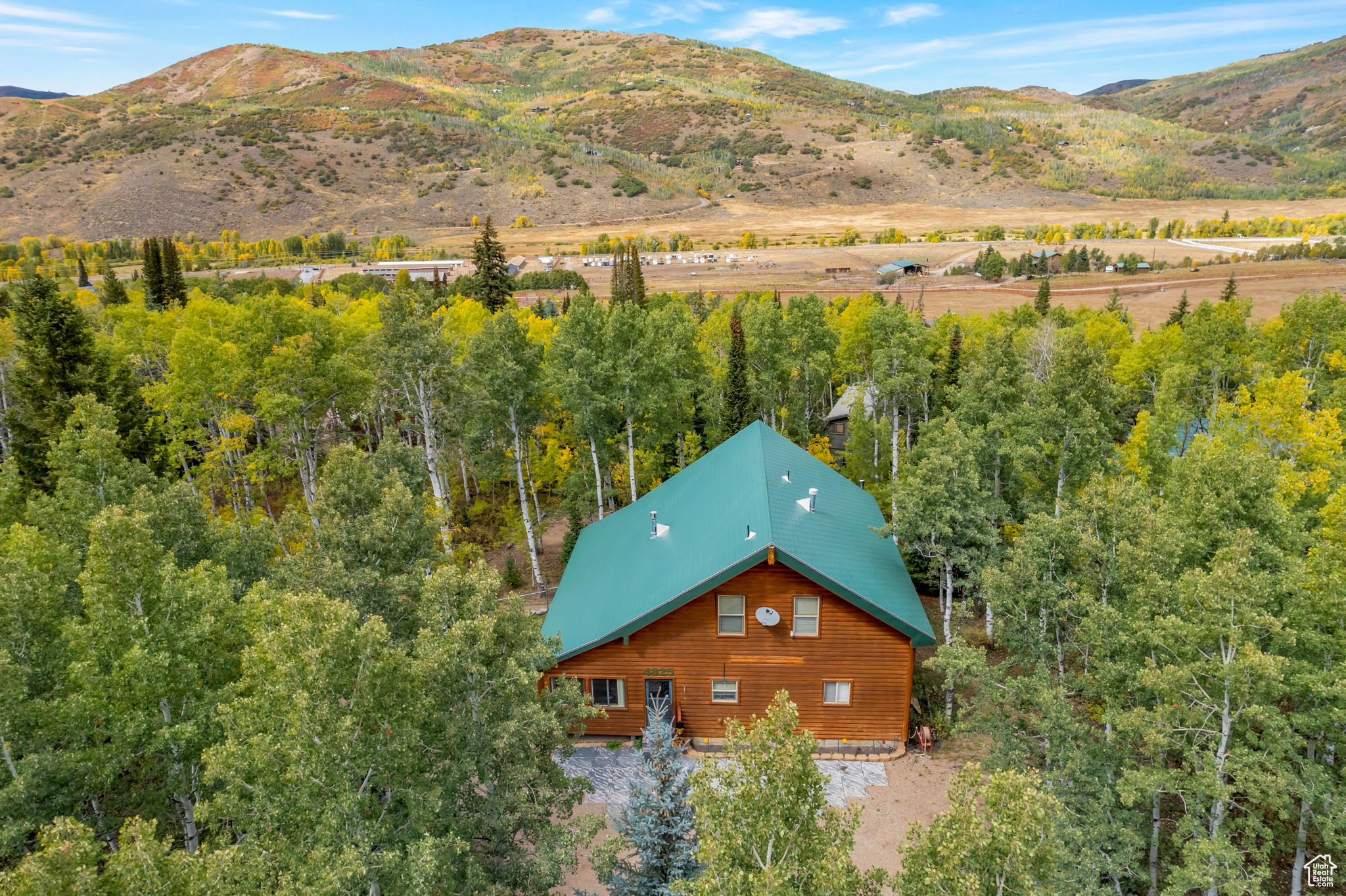 Recent Price Improvement!! Look no further . . . this quaint & cozy cabin in the trees has everything you could desire. Located in the beautiful setting of Pine Mountains just 5 miles from the town of Oakley up the Weber River canyon. This gated cabin community features acres of open space, new Pickleball and basketball courts, along with access to miles of trails for your favorite summer or winter recreation. The cabin itself is perfect for quiet weekends or hosting a crowd of family and friends. The classic log exterior has plentiful deck space and includes a closed in porch for even more useable space in any weather. Four different heat sources keep this cabin warm and cozy in the winter months, while the cool summer breezes offer a great escape from the valley heat. The primary suite offers direct access to the exterior deck for enjoying the sounds and smells of the mountains. The basement offers extra space for hosting guests or storing toys, along with an extra deep garage with workshop area. Plenty of RV and guest parking in the semi-circle driveway. Truly a million dollar cabin without the big price-tag. Seller is motivated and will consider all offers.