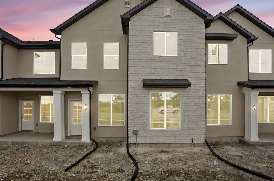 Discover the difference in this beautiful new construction end-unit townhome by Timber Brook Homes, one of Tremonton's most trusted builders. Designed with care and built to last, this home features a bright, open layout that feels spacious and inviting from the moment you walk in. The kitchen's custom cabinetry and thoughtful finishes reflect Timber Brook's commitment to quality. Upstairs, the spacious primary suite has a large, double-sink vanity and large walk-in closet. Nestled in a quiet yet convenient location, you'll enjoy the perfect blend of comfort, style, and easy access to everything Tremonton has to offer. The Seller is offering a $4,000 concession when using their preferred lender, Kaden Niemann with Bolt Home Mortgage. Come take a look today!
