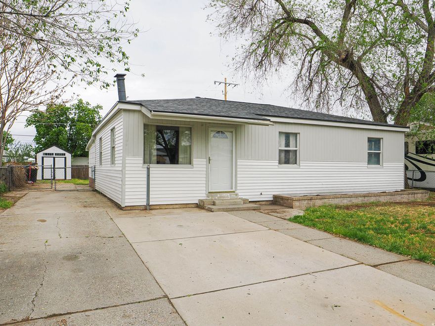 Fresh, clean, and ready for you! This single level move-in-ready home has been thoroughly updated for the next owner. The interior and exterior feature fresh paint, new flooring, new kitchen cabinets, quartz countertops, a gas stove, a pantry, mudroom and is open and bright! The primary bedroom is extra large and includes a walk in closet. Fenced yard, RV parking and with a transferable roof warranty, newer HVAC, and updated plumbing, you can spend your weekends enjoying the fenced backyard rather than worrying about maintenance.