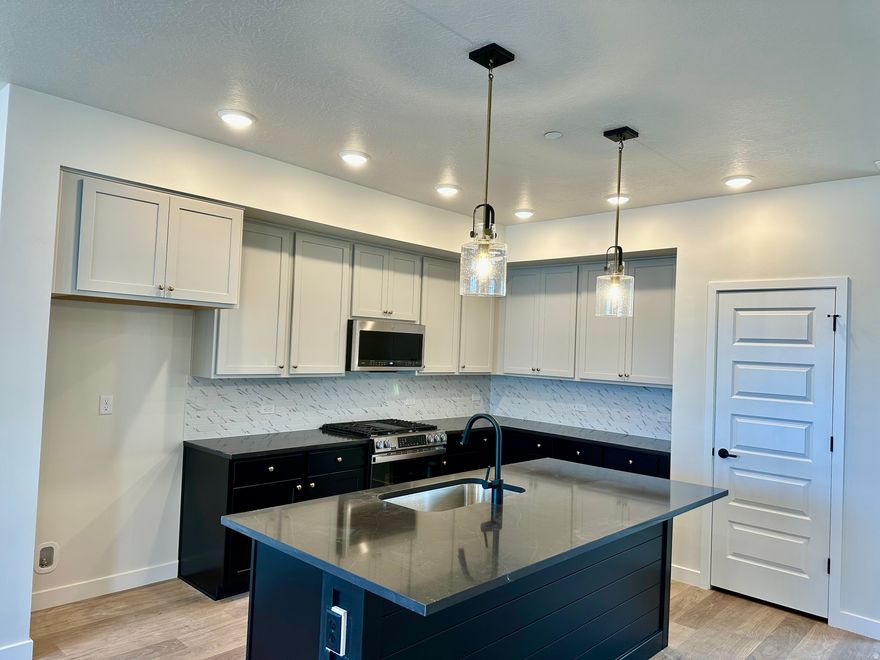 Move-In By End of Month! Enjoy  living in a location that puts you close to it all-walk to Soda Row, Oquirrh Lake, the library, and America First Square Stadium. The area is known for community events and a lively neighborhood feel, with limited nearby construction. Inside, large, well-placed windows bring in abundant natural light and highlight incredible mountain views. The home is designed to feel bright, open, and connected to its surroundings. Move in before summer and start enjoying everything the neighborhood has to offer. In-house lending options help make the home buying process simple and straightforward.