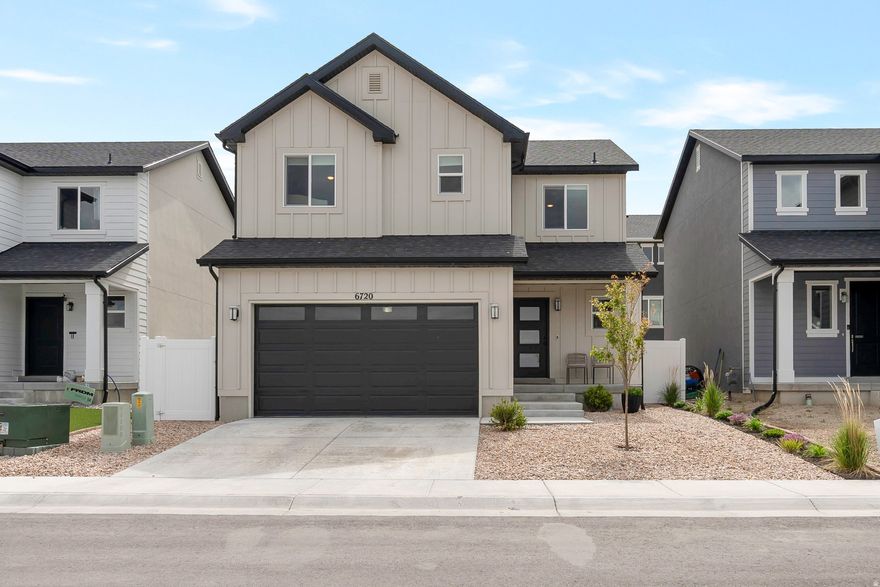 Welcome to your new home at Boulder at Sky Ranch in West Jordan! This spacious home features an open main floor with a stunning 10' sliding glass door that fills the space with natural light. The gourmet kitchen is beautifully designed with stainless steel appliances, stylish finishes, and ample counter space. Upstairs, the large primary suite boasts a vaulted ceiling, walk-in closet, and a luxurious bath with a barn door entrance, walk-in shower, and soaker tub. Bedrooms 2 and 3 are generous in size, providing plenty of comfort and flexibility. All bathrooms throughout the home also feature granite countertops and back-lit mirrors. The unfinished basement offers room to grow and customize to your needs. The home also comes equipped with healthy home features including an Active Radon mitigation system with fan, low FOC finishes, and Pentair Everpure inline kitchen water filtration system. Outside, the home features full xeriscape landscaping with a large covered patio in the backyard and 240 electrical hook-up ready for a hot tub. The community amenities also include an enclosed park and access to the pool and pickleball court at the Sky Ranch Townhomes community across the highway. Square footage figures are provided as a courtesy estimate. Buyer is advised to obtain an independent measurement.