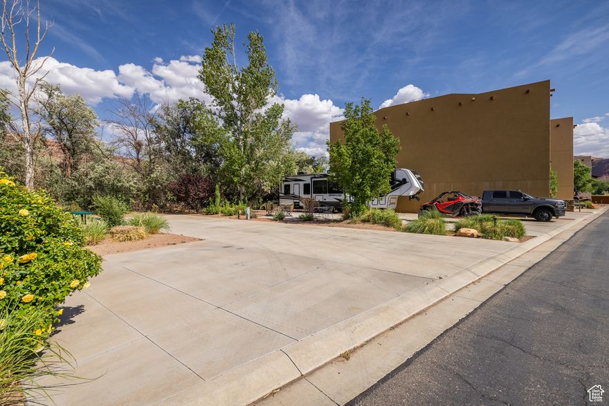 VILLAGE CAMP RESORT LOT- Seize an amazing opportunity to capture the perfect Moab home base for your Motorcoach in a gorgeous, resort setting at Village Camp Moab! This pool-side RV pad features charming landscaping and full hookups, as well as parking for your "toad" vehicle! Resort amenities are excellent, including two beautiful pools, workout facility, guest laundry, playground, and pickleball court. The setting is picture-perfect, with a peaceful location close to the downtown hub, as well as near the entrance to Arches National Park, without having to sacrifice the wild feel of the surrounding desert landscape. Enjoy the option to nightly rent this parcel through Village Camp Resort Management when you are not enjoying your dream Moab vacation destination by RV or with this lot - you have the option build your own casita!