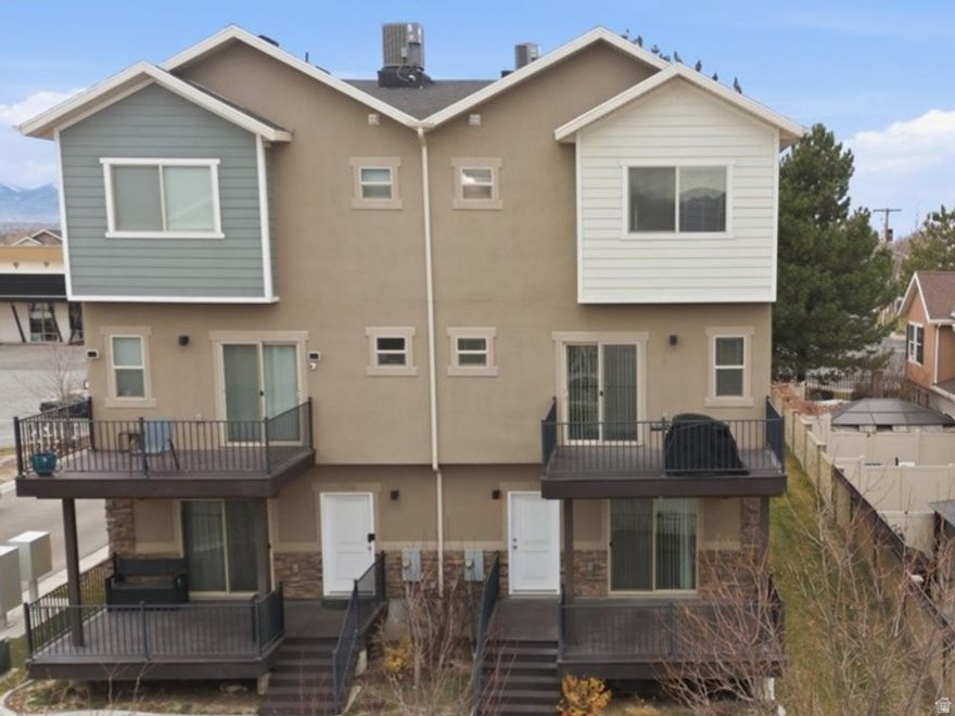 Beautifully kept townhome in West Valley City. Clean, move-in ready, ALL appliances are included! Fridge, Washer, Dryer and Nest smart thermostat. The garage is wired with a 240V AMP plug for your EV car. and minutes to I-215. Bright, open main level with great room flow to the kitchen, island, dining area and laundry right off of the kitchen Upstairs offers well-sized bedrooms, generous closet space. The Master Bedroom boasts a double vanity with a very large walk in closet with separate tub. Private patio for BBQs, plus an attached garage that extra height for your SUV or luggage racks. There is a community playground included with the HOA.   Easy commute location and strong rental/owner-occupant appeal. Please see docs for HOA info and disclosures. Buyer to verify all.