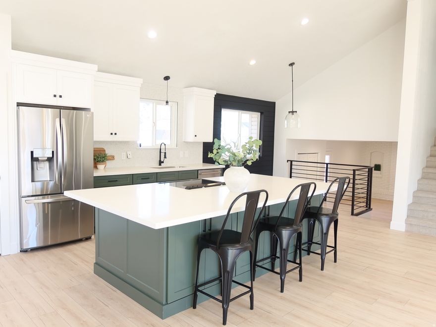 Stunning fully remodeled home on the coveted east side of Sandy featuring breathtaking mountain views. This beautifully updated 2,488 sq ft residence sits on 0.18 acres and offers 5 bedrooms, 3.5 bathrooms and a spacious 2 car garage. Designed with both style and functionality in mind, the home showcases quartz countertops throughout, custom soft close cabinetry, and a modern open-concept kitchen equipped with LG stainless steel appliances including a brand new refrigerator, stove, and dishwasher. Durable LVP flooring flows seamlessly throughout the main living areas, while plush new carpet enhances the bedrooms. LED lighting throughout creates a bright modern atmosphere. The upstairs primary suite offers a spacious walk in closet, large bathroom with porcelain tile and a private balcony retreat where you can enjoy peaceful mountain views. Designer details, including shiplap accents in the kitchen and primary bedroom, add warmth and character. A fully finished basement provides additional living space perfect for entertaining, a second family room, or multiple guest accommodations. With stylish upgrades, generous living space, and a premiere Sandy location, this move-in-ready home truly has it all!