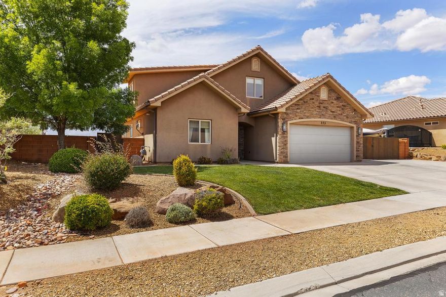 Located at the base of Red Mountain in desirable Ivins UT, this stunning 2,456 sq ft home offers 4 bed, 3 bath, spacious 0.23-acre lot in a quiet neighborhood. Built in 2012, rock/stucco exterior, tile roof, and beautifully landscaped. Enjoy breathtaking red mountain views from the oversized backyard with block wall fencing, in-ground trampoline, gas fire pit hookup, and room for a pool/outdoor kitchen. Inside offers upgraded tile, brand new carpet, can lighting, gas range, bar seating, and abundant storage throughout. Functional layout with main-level primary suite, plus two living spaces including an upstairs family room and bonus study area. RV parking and 2-car garage. HOA $100/month includes front landscaping. Minutes to Black Desert Resort and near Snow Canyon for hiking/biking.