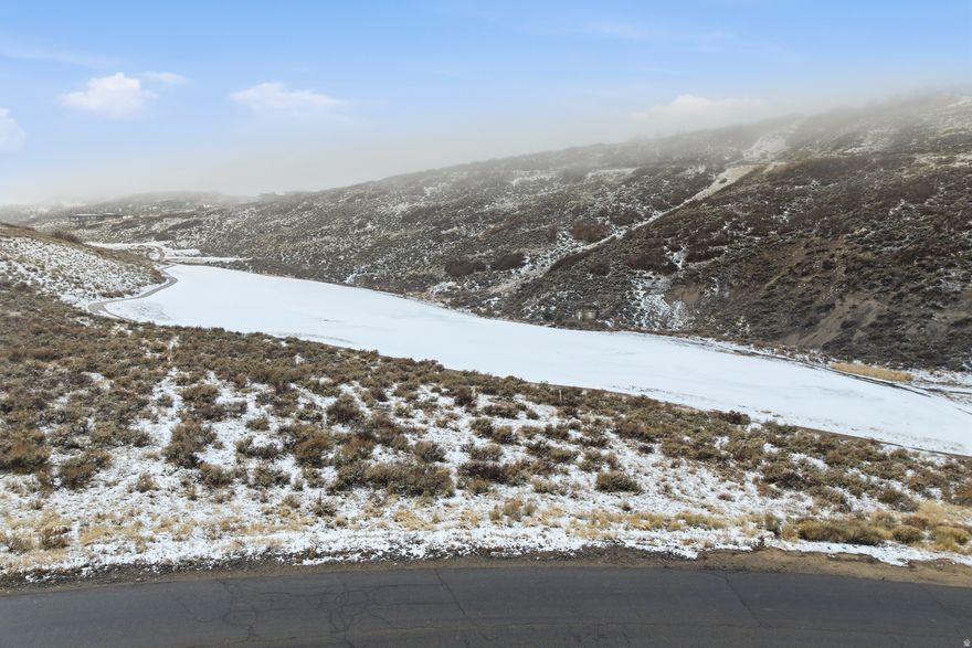 Promontory Homesite Overlooking the Jack Nicklaus Signature Golf Course -- Exceptional 1.28-acre custom homesite in the gated community of Promontory Club, perfectly positioned along the 4th green of the Jack Nicklaus Signature Course in Painted Valley. This desirable golf-frontage parcel features a gentle down-sloping topography and a generous building envelope-ideal for designing and constructing a true generational family retreat with sweeping fairway views and architectural flexibility. Located just moments from the Nicklaus Clubhouse, owners enjoy immediate access to a newly completed ~7,000-square-foot spa, full fitness center, and two on-site dining options, with a proposed pool anticipated in the near future. A rare opportunity to secure a premier homesite combining privacy, scenery, and walkable proximity to world-class amenities-all set within one of Park City's most sought-after private communities.