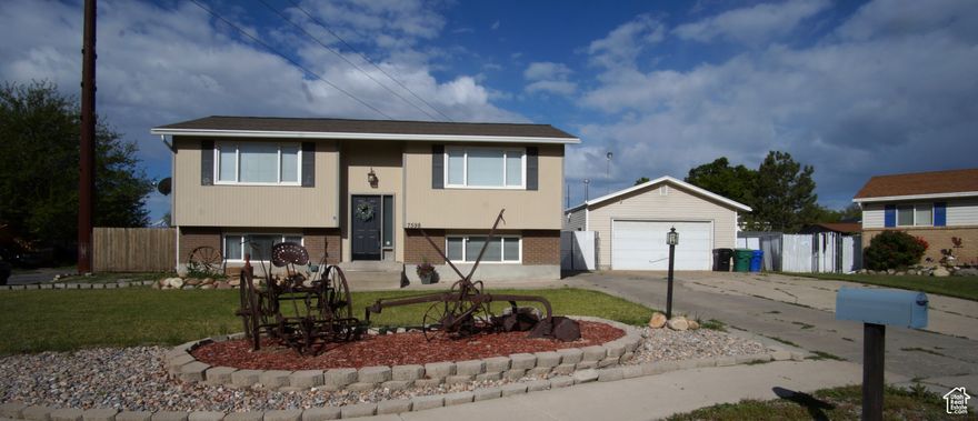 WHAT A FIND! This West Jordan Home is perfect for families, outdoor enthusiasts, and anyone looking for extra space. One of its standout features is the incredible 40'x24' heated garage/shop, complete with a mechanic's pit, workbenches, and storage cabinets. But that's just the beginning! Enjoy a newly  landscaped backyard, Large deck for entertaining,  & gated trailer parking, with 16-foot-wide access gates,a shed for extra storage, and an upgraded, rebuilt deck-perfect for entertaining. A separate basement entrance adds even more convenience. Inside, the 4-bedroom, 2-bath home boasts a spacious, open-concept split-entry layout designed for modern living. The updated kitchen shines with custom maple cabinets, granite countertops, a large  sink, and sleek stainless steel appliances. Throughout the home, fresh paint, new LVP flooring, updated light fixtures, and brand-new outlets and switches give it a stylish, move-in-ready feel. Located on a corner lot in a quiet cul-de-sac, this home offers stunning mountain views and a prime West Jordan location with easy access to shopping, dining, and more. With its thoughtful updates, spacious layout, fantastic shop, extensive storage, and unbeatable RV parking, this home is truly a rare find. Don't miss your chance to see it in person Square footage figures are provided as a courtesy estimate only and were obtained from Previous MLS listings .  Buyer is advised to obtain an independent measurement.