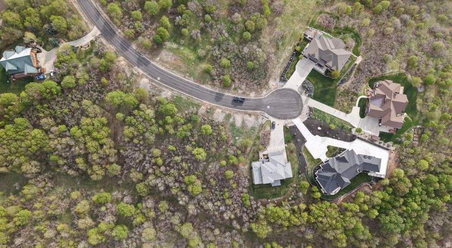 Nestled in the prestigious hills of Woodland Hills, this exceptional homesite offers the perfect blend of privacy, luxury, and breathtaking natural beauty. Located on a quiet cul-de-sac, this premium lot showcases sweeping mountain and valley views, creating an ideal setting for your custom dream home. Surrounded by upscale residences and mature landscape, the property provides a rare opportunity to build in one of Utah County's most sought-after communities.    Enjoy peaceful living with stunning sunrises, cool canyon breezes, and direct access to outdoor recreation just minutes from your doorstep. With utilities nearby and a generous building envelope, this lot is perfectly suited for a luxury estate, whether you're envisioning expansive indoor-outdoor living, panoramic windows, or a private retreat tucked into the hillside.    Conveniently located just minutes from Salem, Spanish Fork, and Payson, you'll enjoy the balance of seclusion and accessibility-close to shopping, dining, and everyday amenities while still feeling worlds away. No HOA, and ideally situated near Summit Creek and Three Bridges, where a private golf course is anticipated within the next year or two, adding even more value and appeal to this already exceptional property.