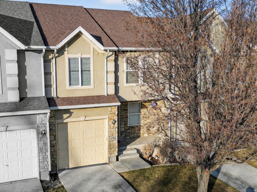 Townhome in a prime central Salt Lake Valley location near Jordan Landing, offering easy access to shopping, dining, and entertainment. The finished basement functions as a fourth bedroom and is plumbed for a fourth bathroom, with ample storage space. The home features updated interior finishes including flooring, countertops, and light fixtures, plus a freshly painted garage. HOA amenities include a playground and a fully fenced dog park.
