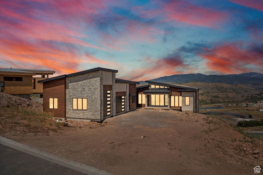 Your wait to own a Luxury Mountain Retreat in Benloch Ranch | Heber City is over!  Welcome to one of Benloch Ranch's most stunning and unique homes-where modern luxury meets mountain serenity-a custom-built masterpiece currently under construction and 90% complete. Spanning over 8,300 sq ft, this architectural masterpiece is designed for elevated living. The home features 7 bedrooms, 8 bathrooms, a private movie theater, exercise room with sauna, and two full kitchens.   From the moment you enter, you'll be captivated by breathtaking panoramic views through expansive accordion patio doors that blend indoor and outdoor living seamlessly. The main kitchen is a chef's dream, featuring a Wolf cooktop and double ovens, Sub-Zero fridge and freezer, two dishwashers, and a walk-in butler's pantry-perfectly suited for entertaining.  Enjoy movie nights in the private theater, recharge in the exercise room and sauna, or host gatherings on the expansive back deck complete with a full outdoor kitchen and gas fireplace.  What truly sets this home apart is the heated and air conditioned 1,597 sq ft indoor sports court located under the garage-offering year-round recreation for basketball, pickleball, and volleyball, regardless of the weather.  To top it all off, the radiant-heated driveway ensures you'll never need to shovel snow again.  Perfectly situated for adventure and relaxation, this home is just minutes from Jordanelle Reservoir, where you can enjoy boating, water skiing, and fishing, and close to the Marcella Club, featuring Tiger Woods' new TGR Design golf course. You're also just a short drive from world-class skiing at Deer Valley Resort, the charm of Historic Main Street in Park City, and Jordanelle Ridge.   With full vacation rental zoning, this home offers exceptional investment potential or the ultimate luxury retreat for you and your guests. Don't miss your opportunity to own this nearly finished one-of-a-kind mountain estate in one of Utah's most desirable new communities.  Schedule your showing today before this one is gone.    Square footage figures are provided as a courtesy estimate only and were obtained from plans .  Buyer is advised to obtain an independent measurement.
