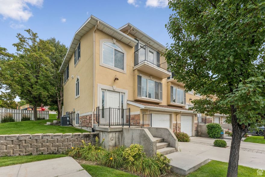 This stunning end-unit townhome, built in 2002 as the builder's original model, is packed with upgrades and modern updates. Featuring new flooring throughout and a rare triple-sided fireplace that warms the living and kitchen areas, this home is designed for comfort and entertaining.  Enjoy the convenience of being the closest unit to the pool, clubhouse, playground, mailbox and extra guest parking. The tandem two-car garage offers abundant storage or space for hobbies. Walking trails weave through the neighborhood, and the Jordan River Trail stretches for miles just steps away.  Located within walking distance to River Oaks Golf Course and only minutes from I-15, America First Field, Topgolf, shopping, dining, and entertainment, this property offers the perfect blend of lifestyle and accessibility.  With its upgraded finishes, end-unit privacy, and unbeatable location, this Sandy townhome is a rare find you won't want to miss!