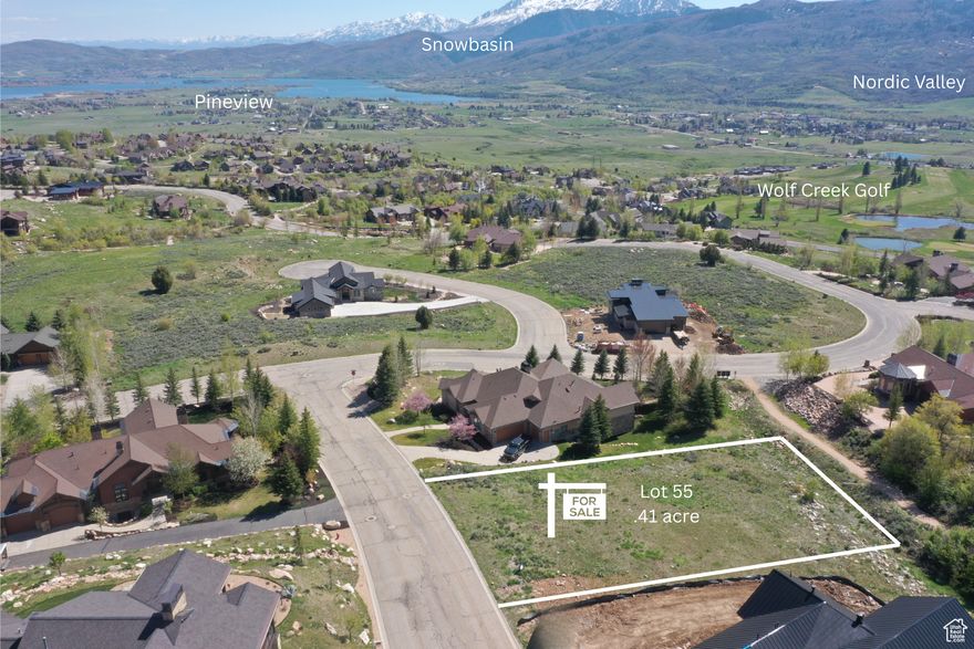 Build Your Dream Mountain Escape -  Water & Sewer Fees ARE PAID ($38K Value!) Welcome to The Highlands at Wolf Creek, where this beautiful .41-acre view lot is ready for your custom mountain retreat. With water and sewer connection fees already paid in full-a $38,000 value, you can start building sooner and save on upfront costs. A completed geological study and stubbed utilities make this property an easy choice for a smooth transition to permits and construction. In the Highlands, you can live your adventurous lifestyle with hiking, biking, boating, swimming and skiing. And relax with the warm sunsets and crisp mountain air in the morning. Powder Mountain is just minutes away! Set against breathtaking vistas of Pineview Reservoir, Ben Lomond Peak, Snowbasin, Nordic Valley, and the Wolf Creek Golf Course, this gently sloped lot offers the perfect balance of views, space, and accessibility. Step out your door to adjacent open space and trail systems and enjoy year-round adventure just minutes away.