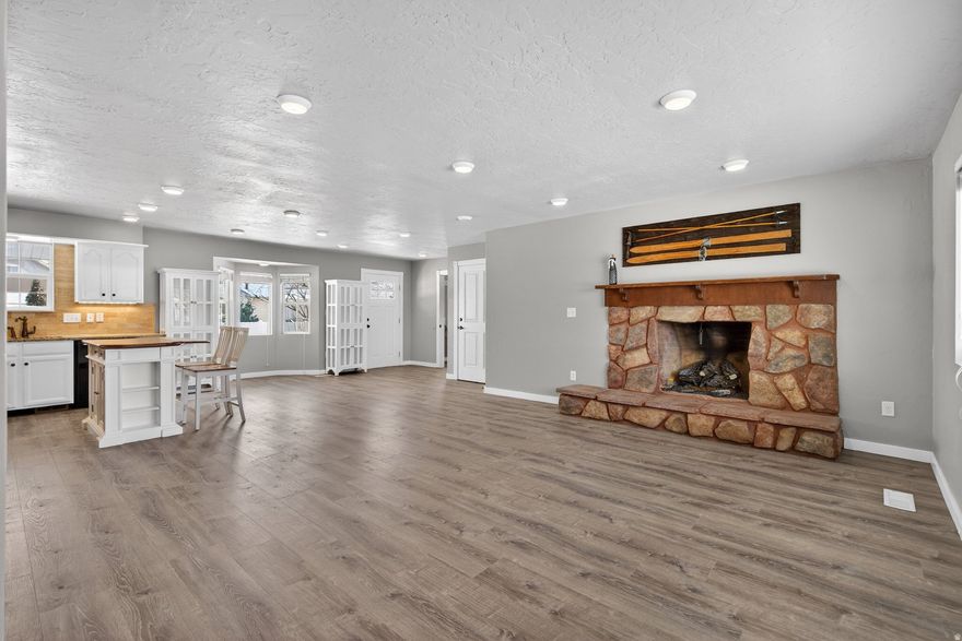 Located conveniently off of Orem Center St, you'll find an updated living space within a charming brick exterior. Enjoy 2 bedrooms and 2 bathrooms upstairs, with an open concept great room and kitchen area, a fireplace, and beautiful views of Cascade and Timpanogos. Downstairs is a 2 bedroom accessory apartment with a separate entrance and private yard you can rent to offset your mortgage. Square footage figures are provided as a courtesy estimate only and were obtained from county records.  Buyer is advised to obtain an independent measurement.