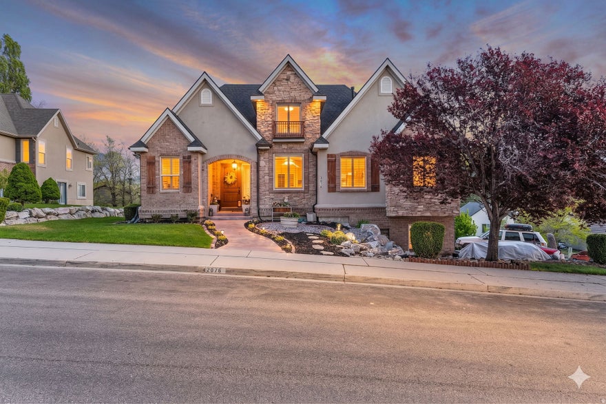 Beautifully updated Lehi home featuring soaring 12-foot ceilings, abundant natural light, and stunning unobstructed views in one of Utah County's most desirable and rapidly growing areas. Major upgrades include a brand-new roof with a 50-year lifespan, new furnace and A/C unit, new water heater, new carpet, upgraded flooring, fresh paint throughout, and top-of-the-line appliances-offering true move-in-ready peace of mind. The spacious kitchen includes an expansive walk-in pantry, while the versatile walk-out basement offers incredible potential for a mother-in-law apartment, rental income opportunity, home gym, theater, or additional living space. Conveniently located near Silicon Slopes, Thanksgiving Point, Traverse Mountain shopping and dining, parks, trails, top-rated schools, and quick I-15 access. Homes like this in Lehi don't come around often and are expected to sell quickly. Buyer to verify all information, including square footage and acreage.