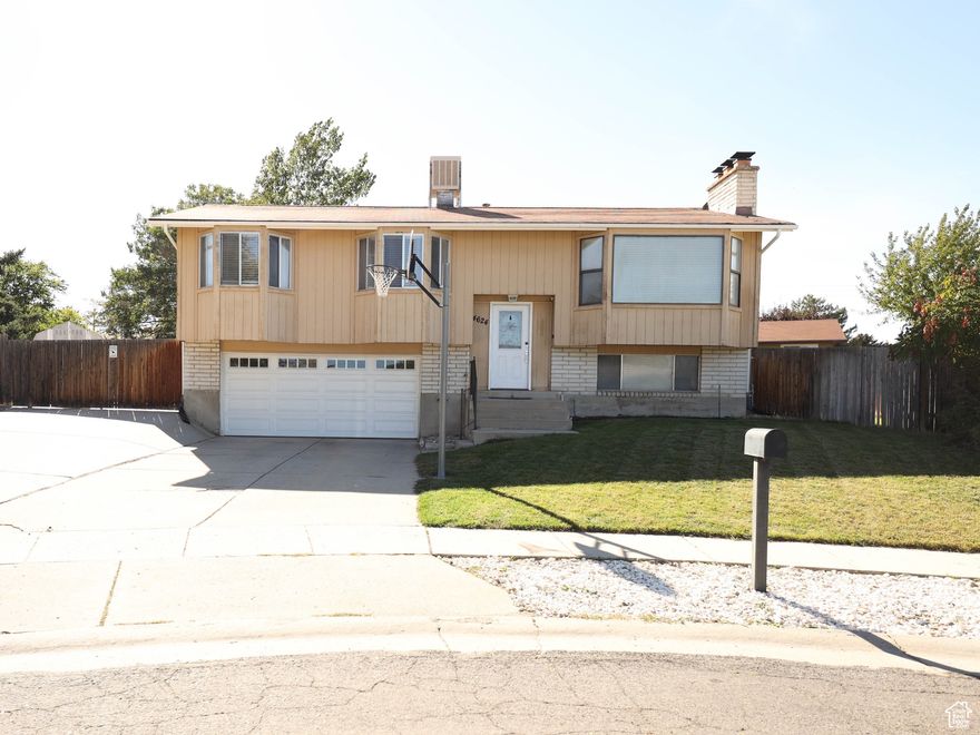 Fantastic location!  Very inviting split-level home perfectly located just east of Bangerter Hwy on a quiet cul-de-sac.   Sitting on an oversized, over a quarter acre, this property offers both space and privacy in a highly desirable location  The backyard is designed for entertaining with a large patio and awning-perfect for summer barbecues, gatherings, or simply relaxing in your own outdoor retreat. The expansive yard provides plenty of room for play, gardening  For those with recreational toys or extra vehicles, the well-planned RV parking.  A large storage shed adds even more flexibility for tools, equipment, or seasonal items.  With its ideal location, generous lot size, and thoughtful outdoor features, this home is a fantastic find.