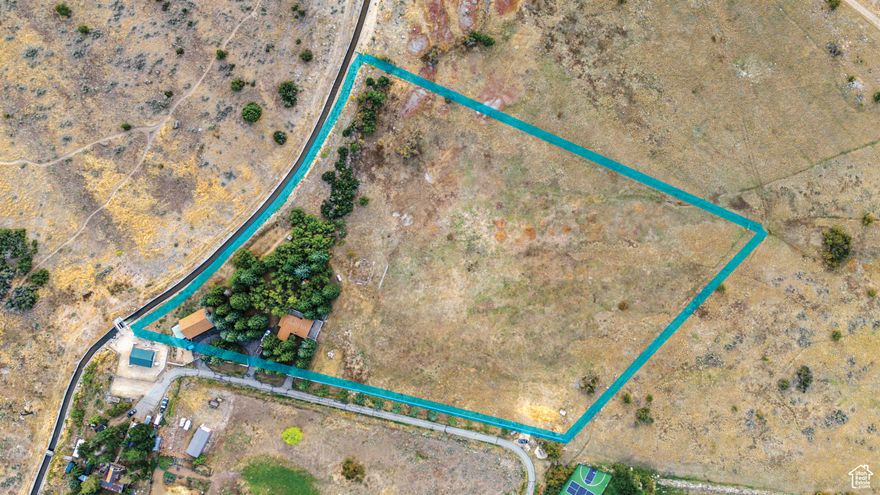 This 7.05 acre development, estate and equestrian parcel boasts spectacular views of the Heber Valley and Mt Timpanogos. It is located within The North Village (NVOZ). Currently in Wasatch County, this parcel has 12 Equivalent Residential Units (ERU's ) allotted. A 1/3 ownership in a private well and 4 shares of Timpanogos Irrigation are included. Mature trees supply shade for a park like setting. .68 acres ownership of Moulton Lane allows you to limit the access of the lower portion of the road. There are three parcel numbers that are included in the sale: 00-0020-7961, 00-0007-7805, and 00-0007-7722.  Located 6 minutes from Deer Valley's East Village and 15 minutes to Park City, the location can't be beat. Marcella Club at Jordanelle Ridge is adjacent to the rear of this parcel. Buy a golf membership, bike the Coyote Trails or head to the Provo River and cast into the blue-ribbon waters all minutes from your door step.